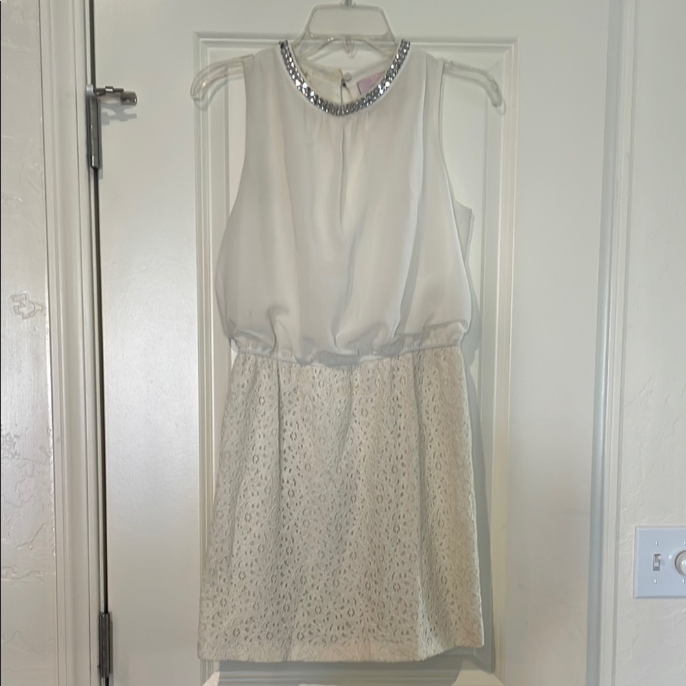 Elegant White Sleeveless Dress with Embellished Neckline